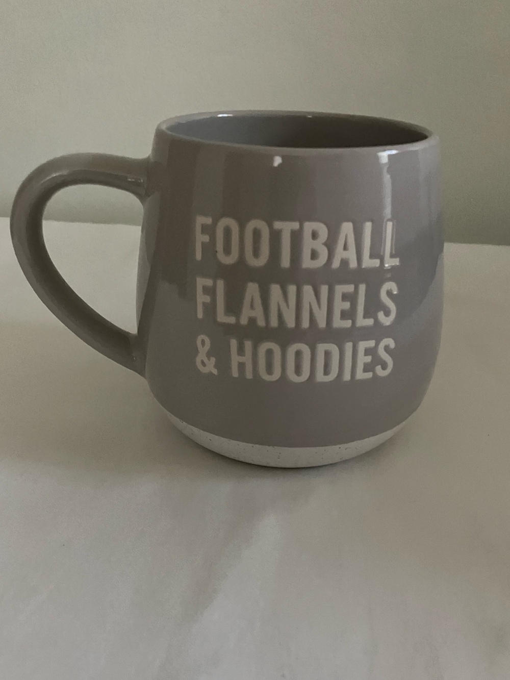 Gray Ceramic Mug with "Football Flannels & Hoodies" Text